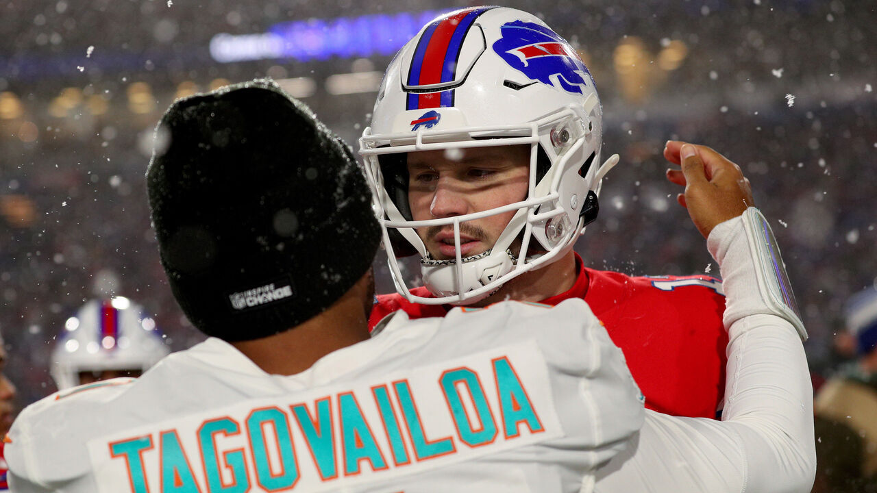 ORCHARD PARK, NEW YORK - DECEMBER 17: Tua Tagovailoa #1 of the Miami Dolphins and Josh Allen #17 of the Buffalo Bills meet on the field after their game at Highmark Stadium on December 17, 2022 in Orchard Park, New York.