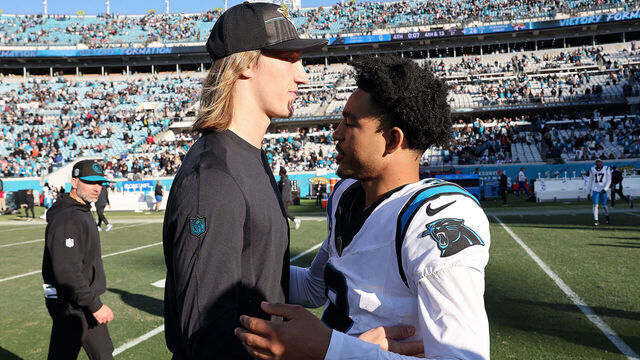 JACKSONVILLE, FLORIDA - DECEMBER 31: Trevor Lawrence #16 of the Jacksonville Jaguars and Bryce Young #9 of the Carolina Panthers hug after Jacksonville's 26-0 win at EverBank Stadium on December 31, 2023 in Jacksonville, Florida.