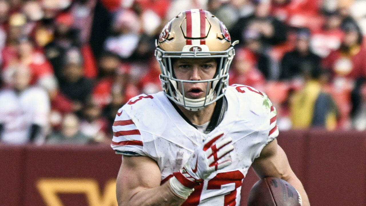 LANDOVER, MD - DECEMBER 31: San Francisco 49ers running back Christian McCaffrey (23) runs for a first down during the NFL game between the San Francisco 49ers and the Washington Commanders on December 31, 2023 at Fed Ex Field in Landover, MD.