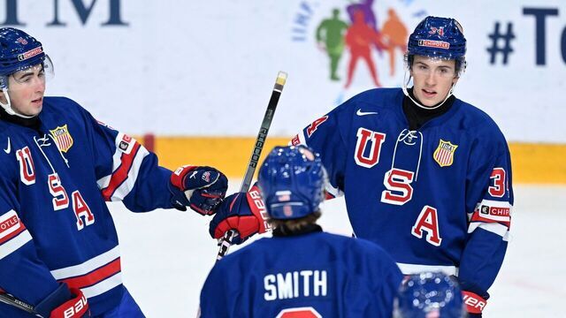 USA's forward Gabe Perreault (R) celebrates scoring with team mates during the quarter-final match between USA and Latvia of the IIHF World Junior Championship in Gothenburg, Sweden on January 2, 2024.