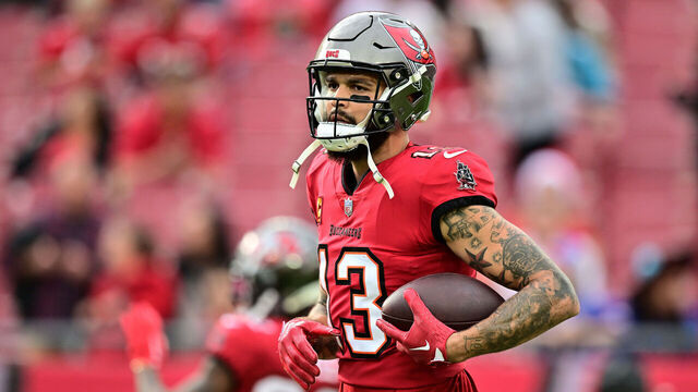 TAMPA, FLORIDA - DECEMBER 24: Mike Evans #13 of the Tampa Bay Buccaneers warms up prior to the game against the Jacksonville Jaguars at Raymond James Stadium on December 24, 2023 in Tampa, Florida.