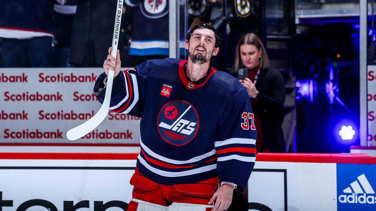 WINNIPEG, CANADA - DECEMBER 22: Goaltender Connor Hellebuyck #37 of the Winnipeg Jets salutes the fans after receiving third star honours following a 5-1 victory over the Boston Bruins at the Canada Life Centre on December 22, 2023 in Winnipeg, Manitoba, Canada.