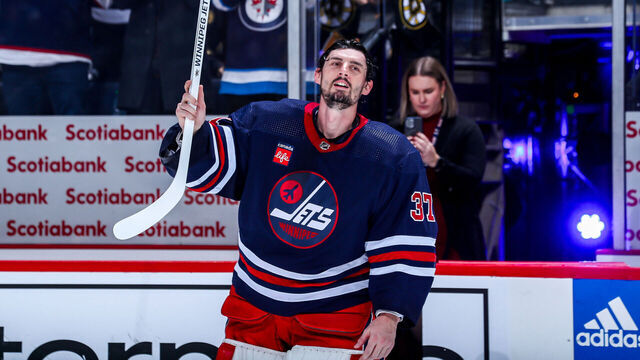WINNIPEG, CANADA - DECEMBER 22: Goaltender Connor Hellebuyck #37 of the Winnipeg Jets salutes the fans after receiving third star honours following a 5-1 victory over the Boston Bruins at the Canada Life Centre on December 22, 2023 in Winnipeg, Manitoba, Canada.