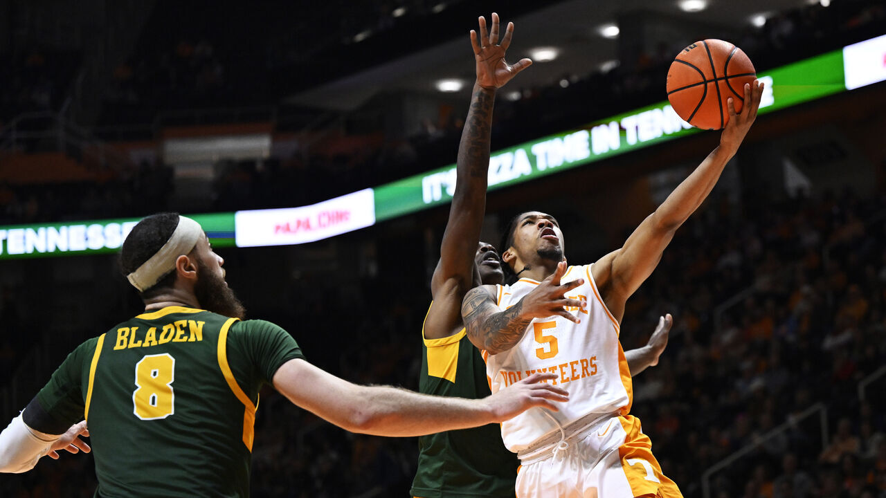 KNOXVILLE, TENNESSEE - JANUARY 02: Zakai Zeigler #5 of the Tennessee Volunteers goes for a layup against Tyrel Bladen #8 and Christian Ings #0 of the Norfolk State Spartans in the first half at Thompson-Boling Arena on January 02, 2024 in Knoxville, Tennessee.