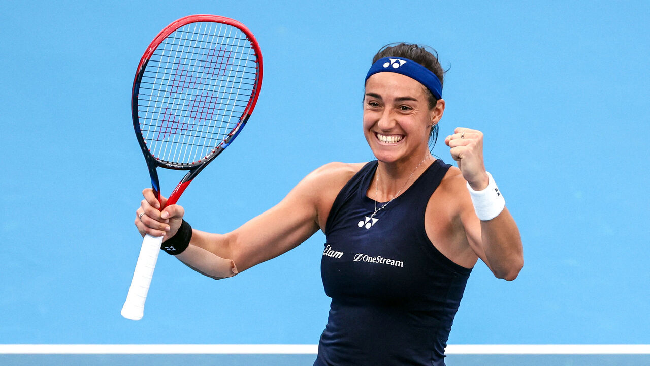 TOPSHOT - France's Caroline Garcia celebrates her win over Italy's Jasmine Paolini in their women's singles match at the United Cup mixed tennis teams event on Ken Rosewall Arena in Sydney on January 3, 2024.
