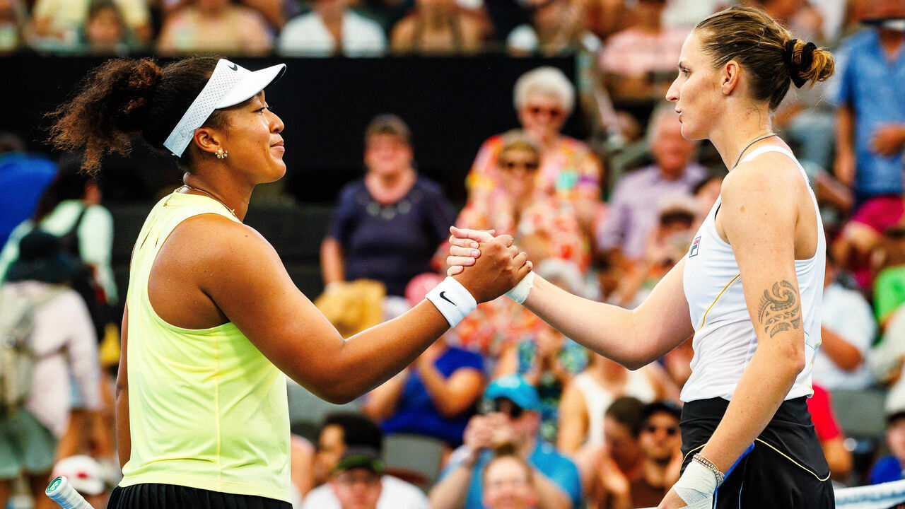 Japan's Naomi Osaka (L) shakes hands with Czech Republic's Karolína Plískova after their women's singles match at the Brisbane International tennis tournament in Brisbane on January 3, 2024.