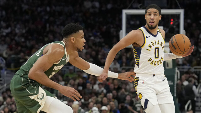 MILWAUKEE, WISCONSIN - JANUARY 01: Tyrese Haliburton #0 of the Indiana Pacers dribbles the ball against Giannis Antetokounmpo #34 of the Milwaukee Bucks during the second half at Fiserv Forum on January 01, 2024 in Milwaukee, Wisconsin.