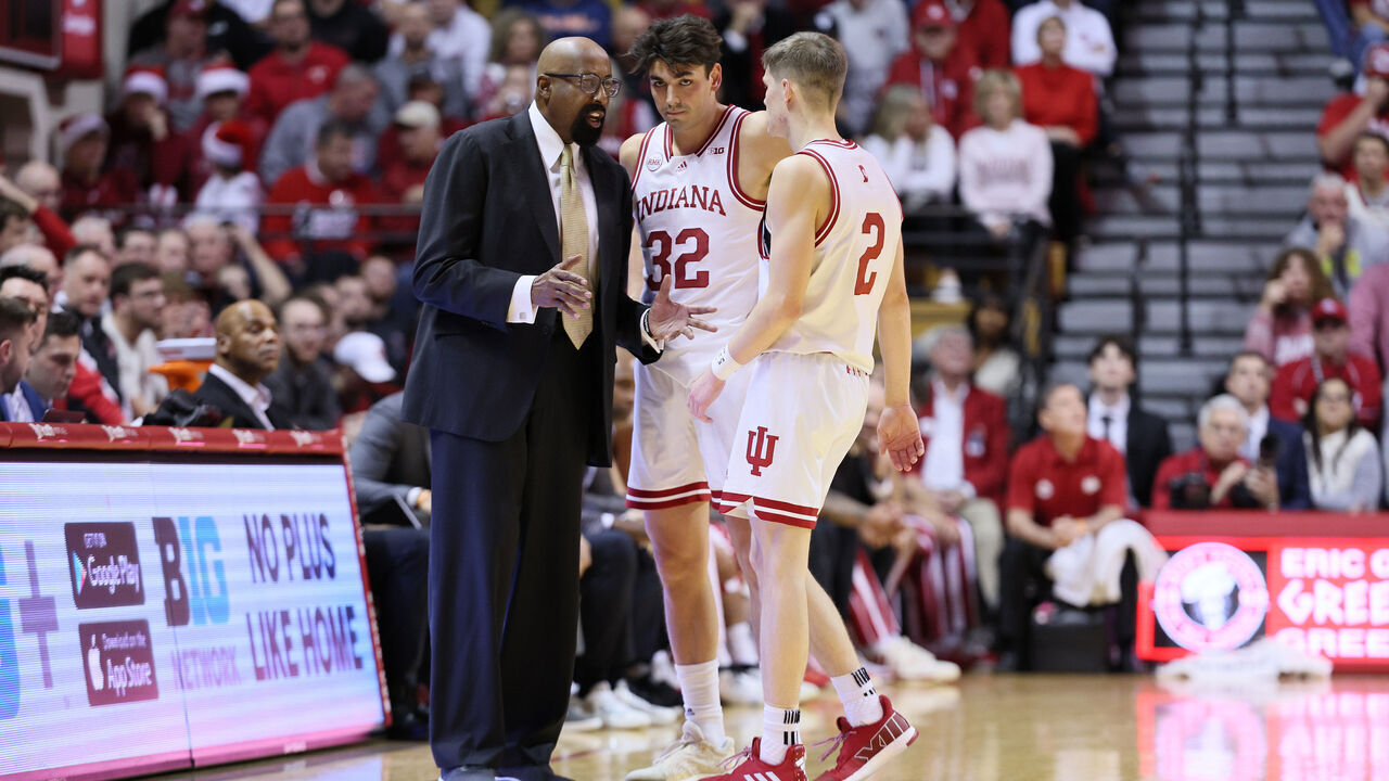 BLOOMINGTON, INDIANA - DECEMBER 19: Mike Woodson the head coach of the Indiana Hoosiers gives instructions to Trey Galloway #32 and Gabe Cupps #2 in the first half against the Morehead State Eagles at Simon Skjodt Assembly Hall on December 19, 2023 in Bloomington, Indiana.