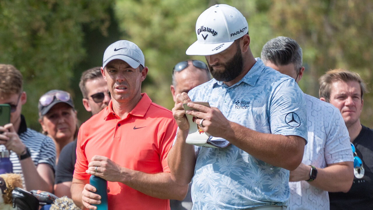 DUBAI, UNITED ARAB EMIRATES - NOVEMBER 16: Rory McIlroy (L) of Ireland and Jon Rahm (R) of Spain are seen plays during the first round on Day One of the DP World Tour Championship on the Earth Course at Jumeirah Golf Estates in Dubai, United Arab Emirates on November 16, 2023.