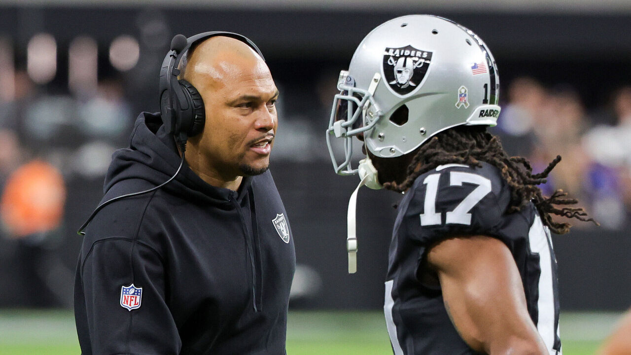 LAS VEGAS, NEVADA - NOVEMBER 05: Interim head coach Antonio Pierce of the Las Vegas Raiders greets wide receiver Davante Adams #17 as he runs off the field after a touchdown by his teammate Jakobi Meyers #16 in the first quarter of a game against the New York Giants at Allegiant Stadium on November 05, 2023 in Las Vegas, Nevada. The Raiders defeated the Giants 30-6.
