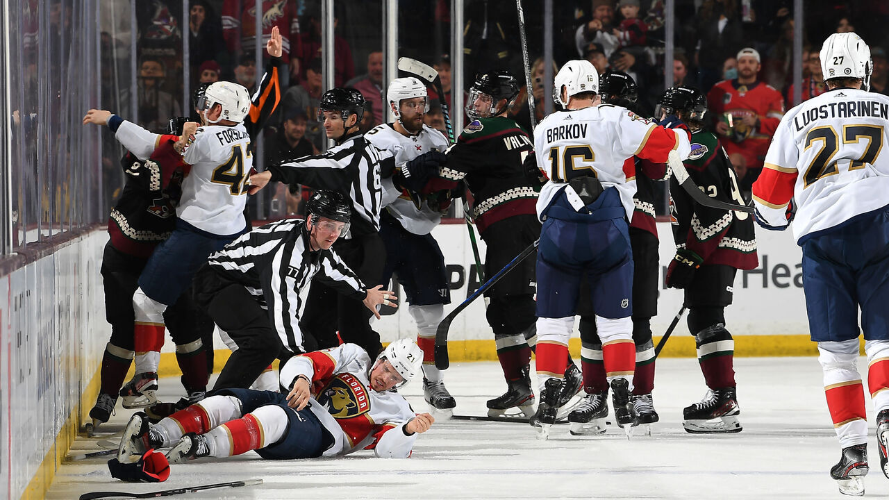 TEMPE, ARIZONA - JANUARY 02: Jason Zucker #16 of the Arizona Coyotes fights Gustav Forsling #42 of the Florida Panthers as teammate Nick Cousins #21 is injured during the second period of the game at Mullett Arena on January 02, 2024 in Tempe, Arizona.