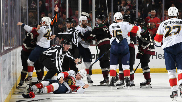 TEMPE, ARIZONA - JANUARY 02: Jason Zucker #16 of the Arizona Coyotes fights Gustav Forsling #42 of the Florida Panthers as teammate Nick Cousins #21 is injured during the second period of the game at Mullett Arena on January 02, 2024 in Tempe, Arizona.