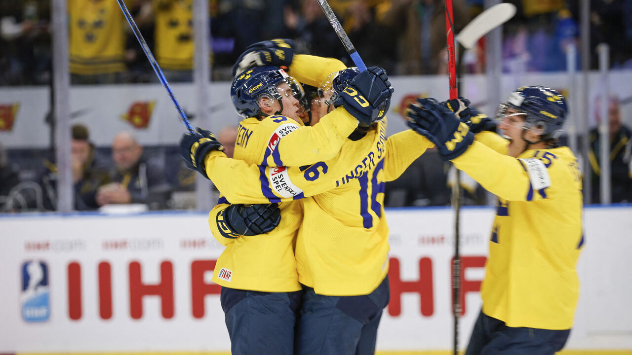 Sweden's defender Theo Lindstein (L) celebrates with teammates scoring during the semi-final match between Sweden and Czech Republic of the IIHF World Junior Championship in Gothenburg, Sweden on January 4, 2024.