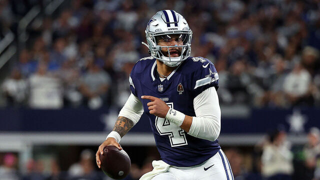 ARLINGTON, TEXAS - DECEMBER 30: Quarterback Dak Prescott #4 of the Dallas Cowboys scrambles with the football against the Detroit Lions at AT&T Stadium on December 30, 2023 in Arlington, Texas.