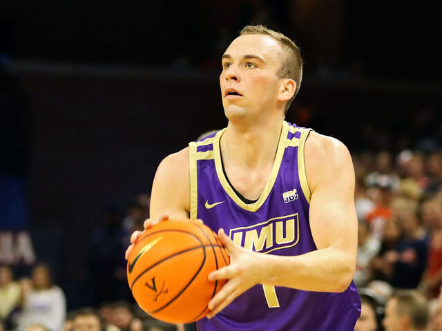 CHARLOTTESVILLE, VA - DECEMBER 06: Noah Freidel #1 of the James Madison Dukes shoots in the first half during a game against the Virginia Cavaliers at John Paul Jones Arena on December 6, 2022 in Charlottesville, Virginia.