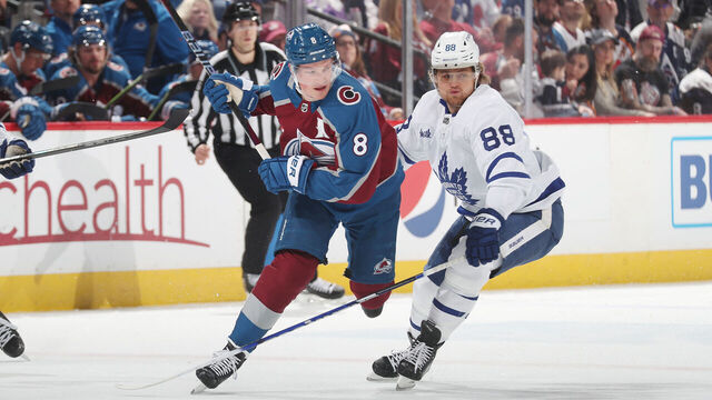 DENVER, COLORADO - DECEMBER 31: Cale Makar #8 of the Colorado Avalanche skates against William Nylander #88 the Toronto Maple Leafs at Ball Arena on December 31, 2022 in Denver, Colorado.
