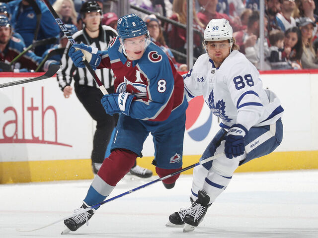 DENVER, COLORADO - DECEMBER 31: Cale Makar #8 of the Colorado Avalanche skates against William Nylander #88 the Toronto Maple Leafs at Ball Arena on December 31, 2022 in Denver, Colorado.