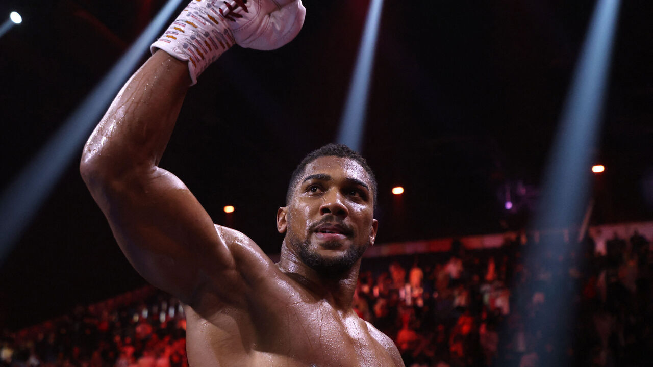 CORRECTION / Britain's Anthony Joshua celebrates after defeating Sweden's Otto Wallin during their heavyweight boxing match at the Kingdom Arena in Riyadh on December 23, 2023.