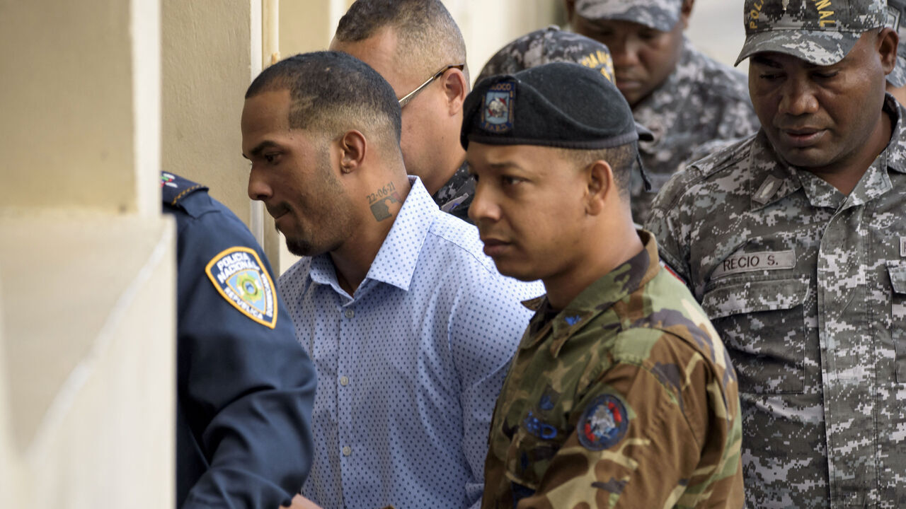Tampa Bay Rays Dominican baseball shortstop Wander Franco (L), who faces an accusation of molesting an underage girl, arrives in court under heavy escort in Puerto Plata, in Dominican Republic, on January 5, 2024. The hearing was being held behind closed doors and Franco, 22, who is eligible for the Major League Baseball All-Star Game in the 2023 season, did not make a statement before entering. The baseball player and the mother of the 15-year-old girl were charged with "the crimes of commercial sexual exploitation and money laundering."