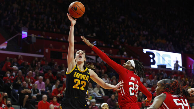 PISCATAWAY, NEW JERSEY - JANUARY 5: Caitlin Clark #22 of the Iowa Hawkeyes attempts a shot as Erica Lafayette #20 and Chyna Cornwell #54 of the Rutgers Scarlet Knights defend during the first half of a game at Jersey Mike's Arena on January 5, 2024 in Piscataway, New Jersey.