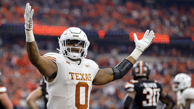 ARLINGTON, TX - DECEMBER 2: tight end Ja'Tavion Sanders #0 of the Texas Longhorns celebrates after a touchdown against the Oklahoma State Cowboys in the first half of the Big 12 Championship at AT&T Stadium on December 2, 2023 in Arlington, Texas.