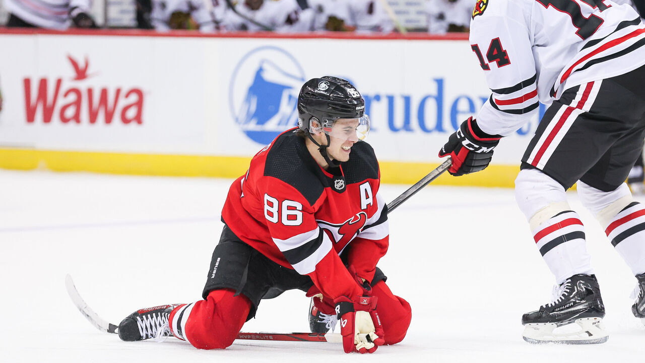 NEWARK, NJ - JANUARY 05: New Jersey Devils center Jack Hughes (86) falls on the ice during a game between the Chicago Blackhawks and New Jersey Devils on January 05, 2024 at Prudential Center in the Newark, New Jersey.