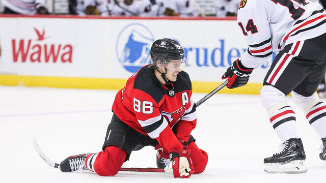 NEWARK, NJ - JANUARY 05: New Jersey Devils center Jack Hughes (86) falls on the ice during a game between the Chicago Blackhawks and New Jersey Devils on January 05, 2024 at Prudential Center in the Newark, New Jersey.