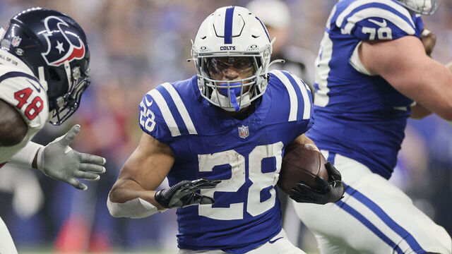 INDIANAPOLIS, INDIANA - JANUARY 06: Jonathan Taylor #28 of the Indianapolis Colts runs with the ball during the first quarter against the Houston Texans at Lucas Oil Stadium on January 06, 2024 in Indianapolis, Indiana.