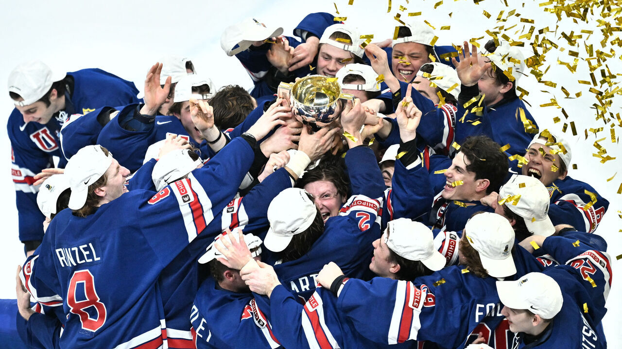 TOPSHOT - USA's players celebrate with the trophy after winning the final ice hockey match between USA and Sweden of the IIHF World Junior Championship in Gothenburg, Sweden on January 5, 2024.