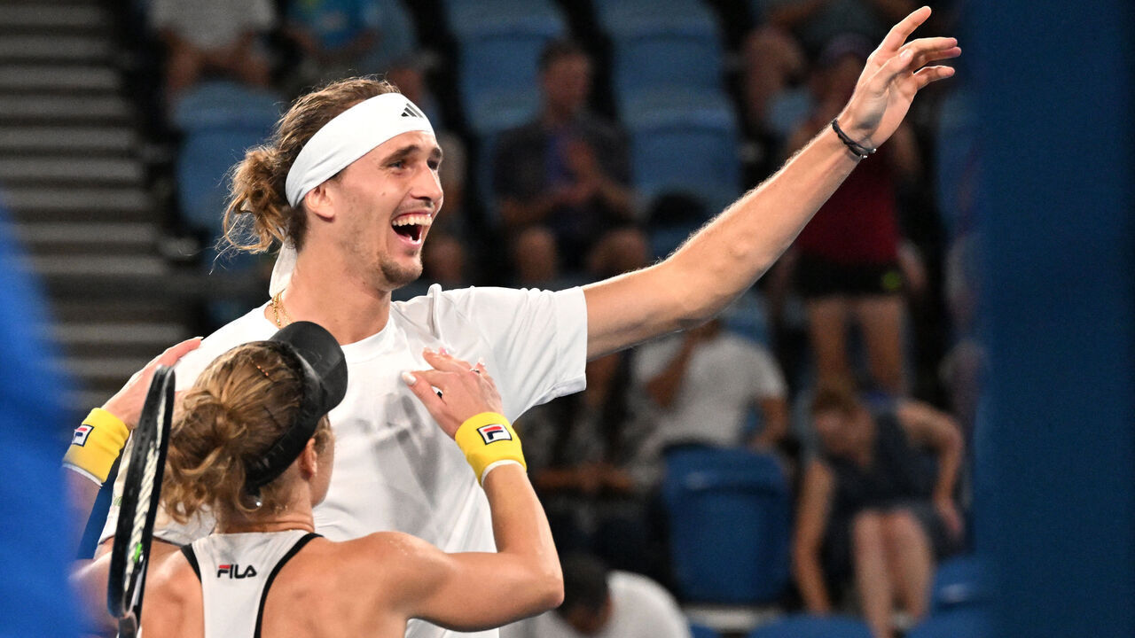 Germany's Alexander Zverev (top) and Laura Siegemund celebrate their win against Poland's Iva Swiatek and Hubert Hurkacz in their mixed doubles final at the United Cup tennis event at Ken Rosewall Arena in Sydney on January 8, 2024.
