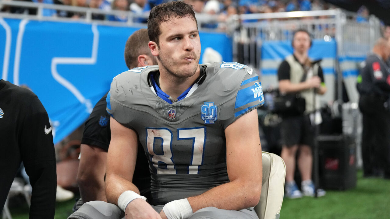 DETROIT, MICHIGAN - JANUARY 07: Sam LaPorta #87 of the Detroit Lions is taken off the field during the first half in the game against the Minnesota Vikings at Ford Field on January 07, 2024 in Detroit, Michigan.