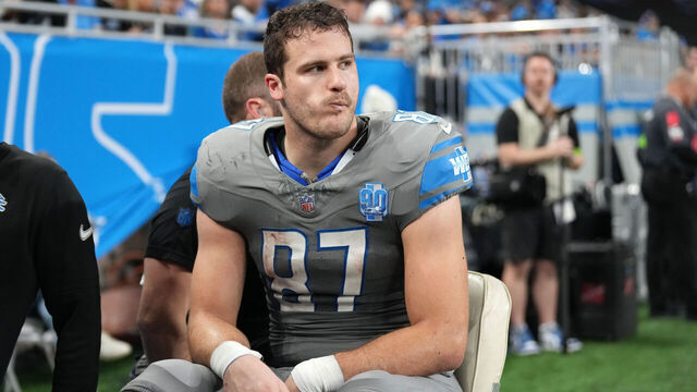 DETROIT, MICHIGAN - JANUARY 07: Sam LaPorta #87 of the Detroit Lions is taken off the field during the first half in the game against the Minnesota Vikings at Ford Field on January 07, 2024 in Detroit, Michigan.