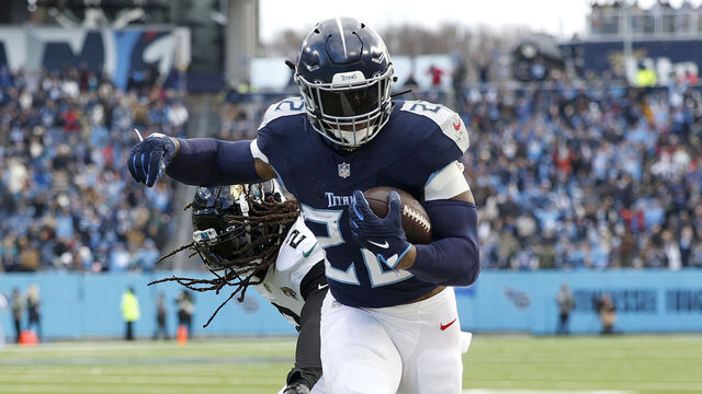 NASHVILLE, TENNESSEE - JANUARY 07: Derrick Henry #22 of the Tennessee Titans runs with the ball for a touchdown during the second quarter against the Jacksonville Jaguars at Nissan Stadium on January 07, 2024 in Nashville, Tennessee.