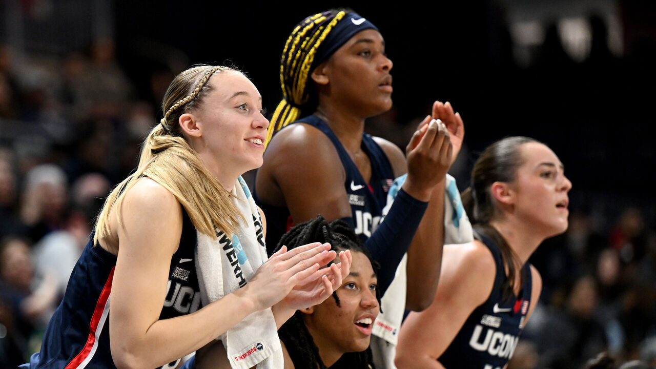 WASHINGTON, DC - JANUARY 07: Paige Bueckers #5, KK Arnold #2, Aaliyah Edwards #3 and Nika Muhl #10 of the UConn Huskies celebrate in the fourth quarter against the Georgetown Hoyas at Entertainment & Sports Arena on January 07, 2024 in Washington, DC.