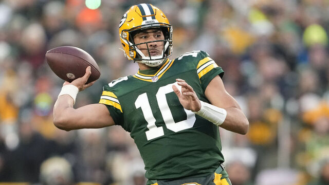 GREEN BAY, WISCONSIN - JANUARY 07: Jordan Love #10 of the Green Bay Packers throws a touchdown pass during the first half in the game against the Chicago Bears at Lambeau Field on January 07, 2024 in Green Bay, Wisconsin.