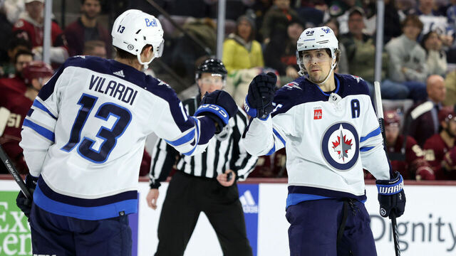 TEMPE, ARIZONA - JANUARY 07: Mark Scheifele #55 of the Winnipeg Jets celebrates with teammate Gabriel Vilardi #13 after scoring an empty net goal against the Arizona Coyotes during the third period at Mullett Arena on January 07, 2024 in Tempe, Arizona.