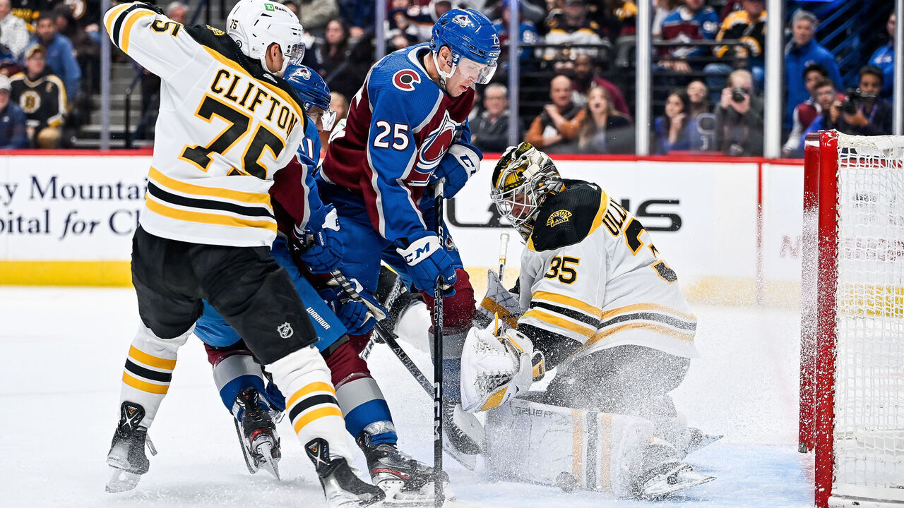 DENVER, COLORADO - DECEMBER 7: Linus Ullmark #35 of the Boston Bruins makes a save as Logan OConnor #25 and Andrew Cogliano #11 of the Colorado Avalanche crash the net and Connor Clifton #75 of the Boston Bruins defends in the second period of a game at Ball Arena on December 7, 2022 in Denver, Colorado.