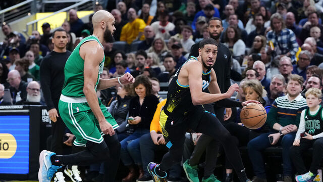 INDIANAPOLIS, INDIANA - JANUARY 06: Tyrese Haliburton #0 of the Indiana Pacers dribbles the ball while being guarded by Derrick White #9 of the Boston Celtics in the first quarter at Gainbridge Fieldhouse on January 06, 2024 in Indianapolis, Indiana.