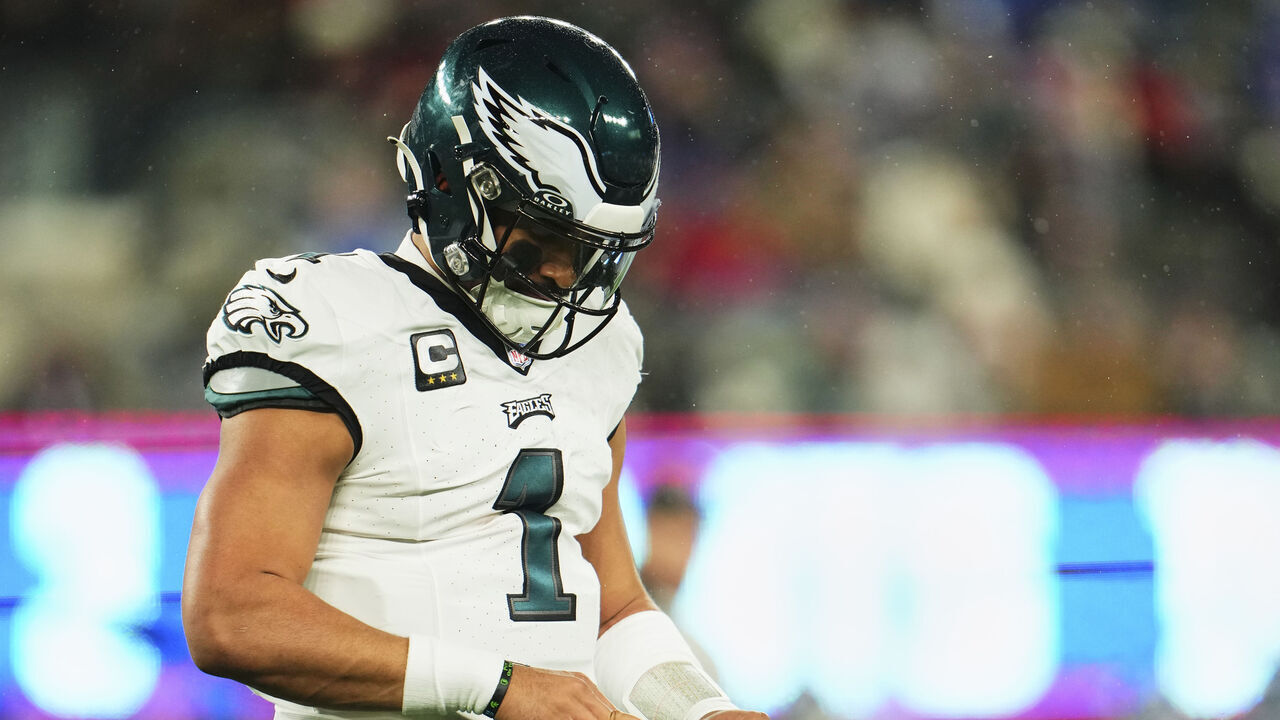 EAST RUTHERFORD, NJ - JANUARY 07: Jalen Hurts #1 of the Philadelphia Eagles looks at his finger against the New York Giants during the first half at MetLife Stadium on January 7, 2024 in East Rutherford, New Jersey.
