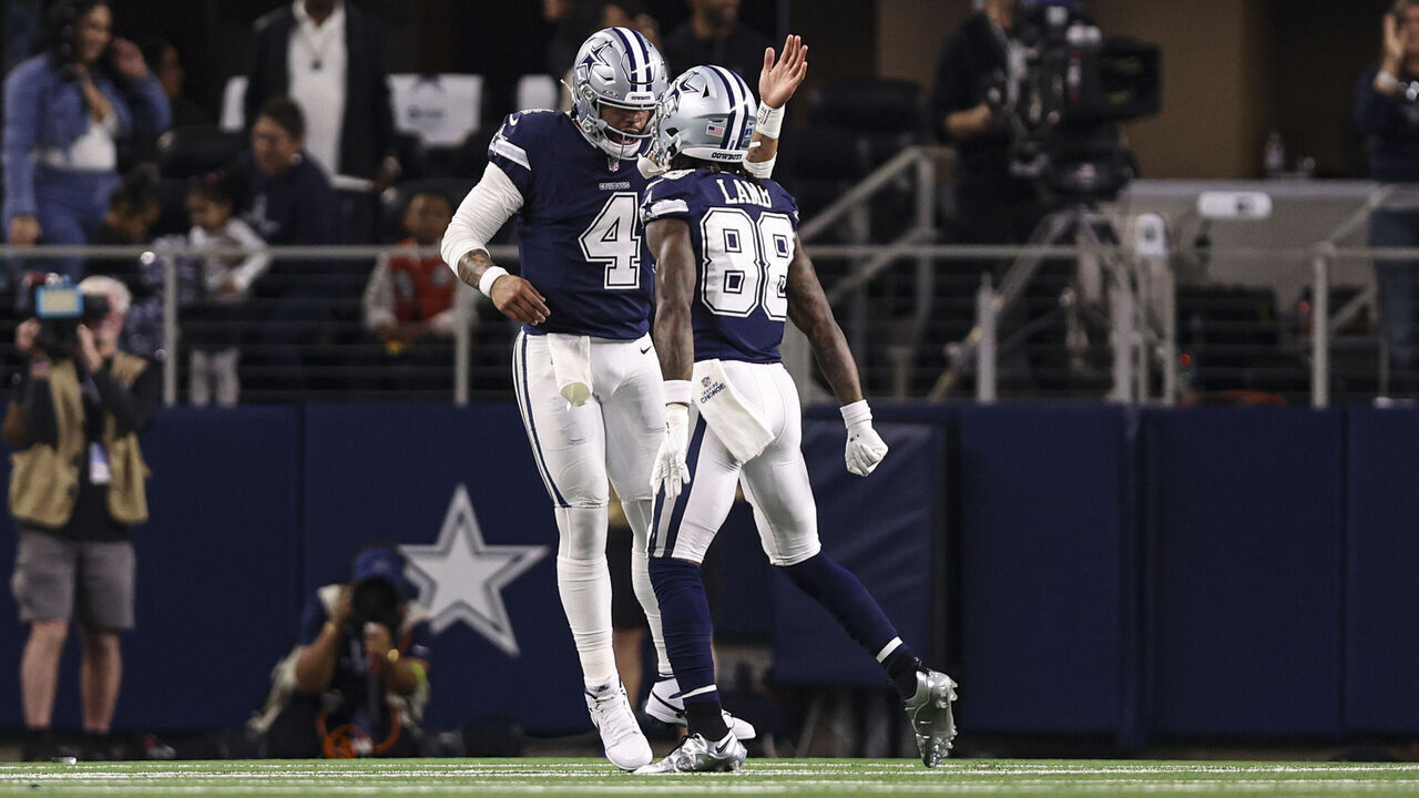 ARLINGTON, TX - DECEMBER 30: Dak Prescott #4 of the Dallas Cowboys celebrates with teammate CeeDee Lamb #88 during an NFL football game against the Detroit Lions at AT&T Stadium on December 30, 2023 in Arlington, Texas.