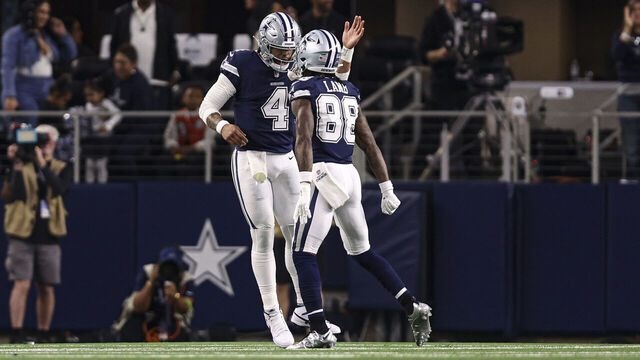 ARLINGTON, TX - DECEMBER 30: Dak Prescott #4 of the Dallas Cowboys celebrates with teammate CeeDee Lamb #88 during an NFL football game against the Detroit Lions at AT&T Stadium on December 30, 2023 in Arlington, Texas.