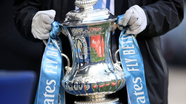 MANCHESTER, ENGLAND - JANUARY 7: A general view of the Manchester City logo and Emirates FA Cup logo reflected in the trophy ahead of the FA Cup trophy during the Emirates FA Cup Third Round match between Manchester City and Huddersfield Town at Etihad Stadium on January 7, 2024 in Manchester, England.