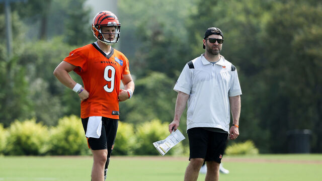 CINCINNATI, OHIO - JULY 29: Joe Burrow #9 of the Cincinnati Bengals and offensive coordinator Brian Callahan look on during training camp on July 29, 2021 in Cincinnati, Ohio.