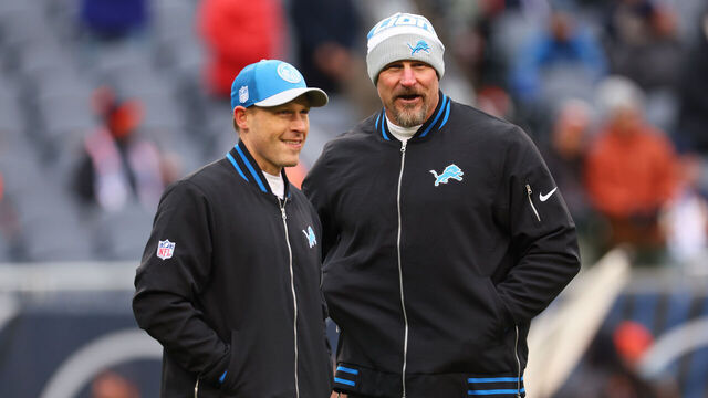 CHICAGO, ILLINOIS - DECEMBER 10: Head coach Dan Campbell of the Detroit Lions speaks with offensive coordinator Ben Johnson prior to the game against the Chicago Bears at Soldier Field on December 10, 2023 in Chicago, Illinois.