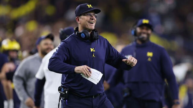HOUSTON, TEXAS - JANUARY 08: Head coach Jim Harbaugh of the Michigan Wolverines reacts after a touchdown in the fourth quarter against the Washington Huskies during the 2024 CFP National Championship game at NRG Stadium on January 08, 2024 in Houston, Texas.