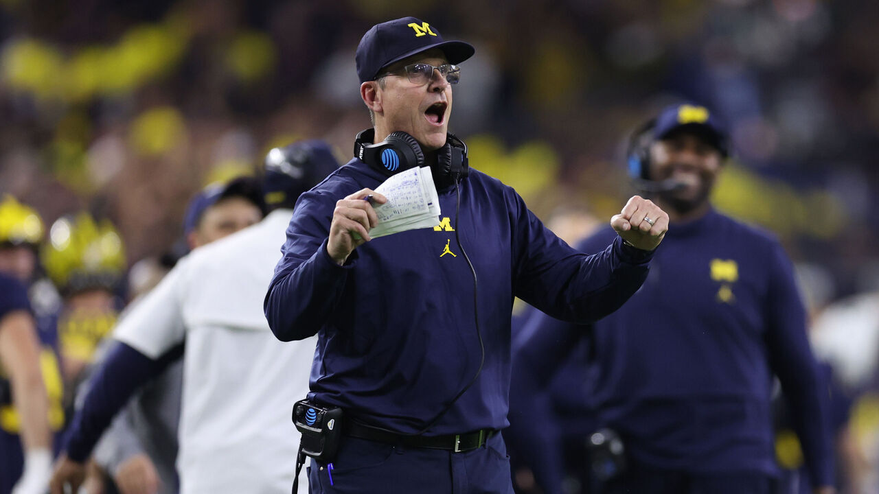 HOUSTON, TEXAS - JANUARY 08: Head coach Jim Harbaugh of the Michigan Wolverines reacts after a touchdown in the fourth quarter against the Washington Huskies during the 2024 CFP National Championship game at NRG Stadium on January 08, 2024 in Houston, Texas.