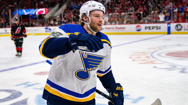 RALEIGH, NORTH CAROLINA - JANUARY 06: Nathan Walker #26 of the St. Louis Blues celebrates after scoring a goal against the Carolina Hurricanes in the first period during their game at PNC Arena on January 06, 2024 in Raleigh, North Carolina.
