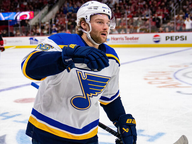 RALEIGH, NORTH CAROLINA - JANUARY 06: Nathan Walker #26 of the St. Louis Blues celebrates after scoring a goal against the Carolina Hurricanes in the first period during their game at PNC Arena on January 06, 2024 in Raleigh, North Carolina.