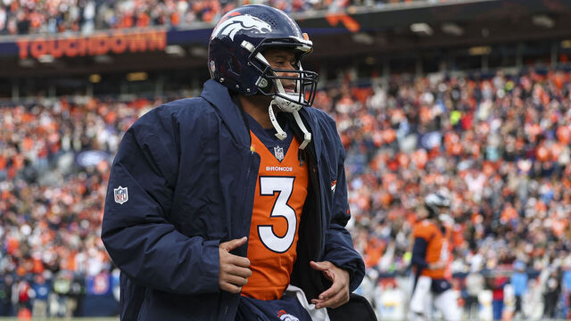 DENVER, CO - DECEMBER 31: Russell Wilson #3 of the Denver Broncos looks on from the sideline during an NFL football game against the Los Angeles Chargers at Empower Field at Mile High on December 31, 2023 in Denver, Colorado.