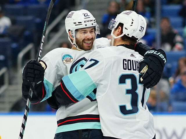 BUFFALO, NEW YORK - JANUARY 9: Yanni Gourde #37 celebrates his first period goal with Oliver Bjorkstrand #22 of the Seattle Kraken during an NHL game against the Buffalo Sabres on January 9, 2024 at KeyBank Center in Buffalo, New York.